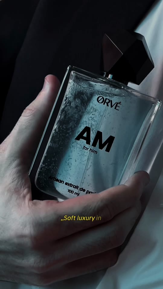 ŌRVE AM for Him extrait de parfum bottle in hand